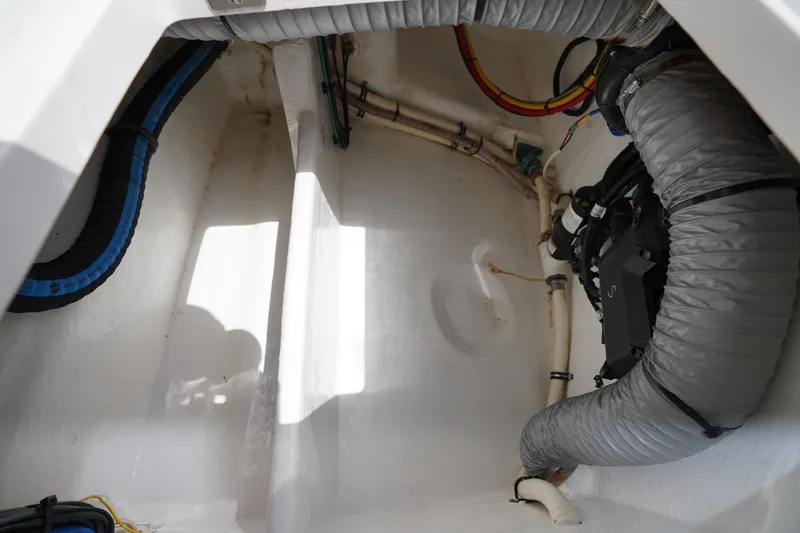 Slide: The Image of Interior view of 2015 Intrepid 400 Cuddy boat showing mechanical components and wiring. - 55