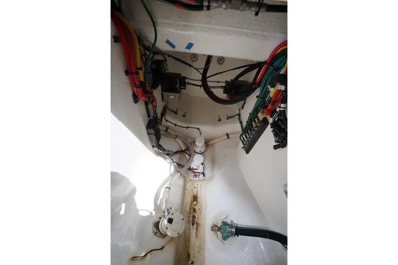 Slide: The Image of Interior wiring and components of a 2015 Intrepid 400 Cuddy boat. - 58