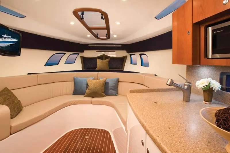 Slide: The Image of Control panel of a 2015 Intrepid 400 Cuddy boat with navigation and audio systems. - 6