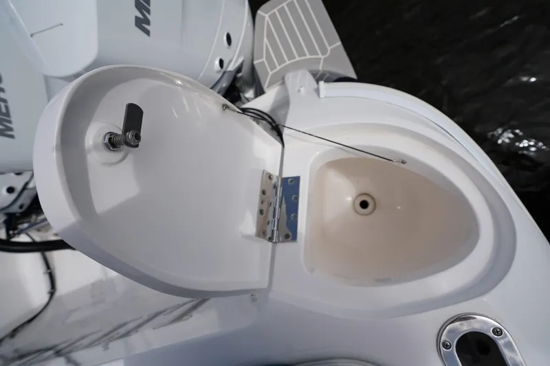 Slide: The Image of Open hatch on 2015 Intrepid 400 Cuddy boat, revealing storage compartment. - 65