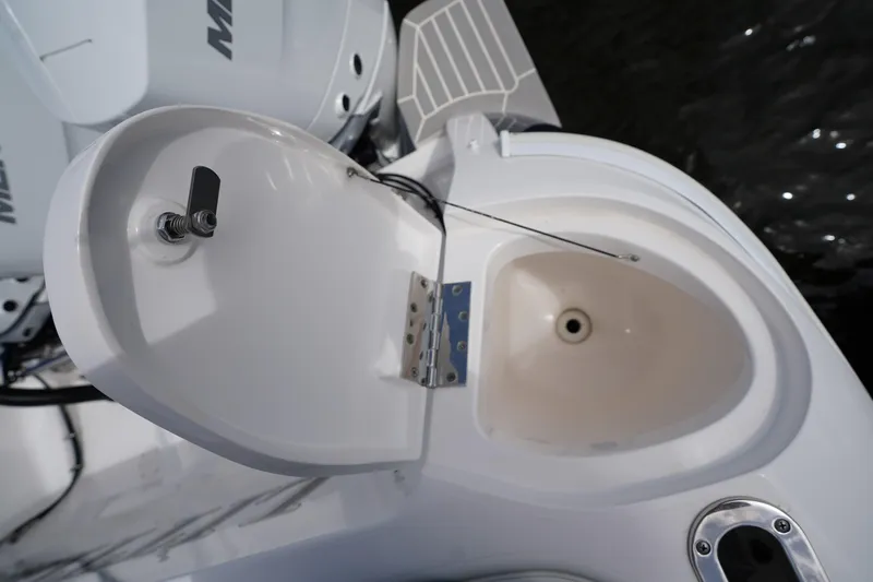 Slide: The Image of Open hatch on 2015 Intrepid 400 Cuddy boat, revealing storage compartment. - 66
