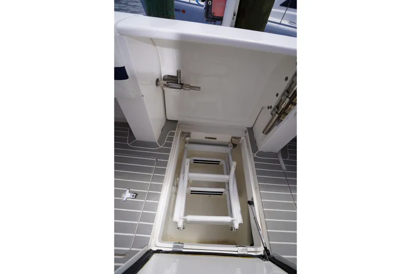 Slide: The Image of 2015 Intrepid 400 Cuddy boat hatch with integrated ladder on deck. - 67