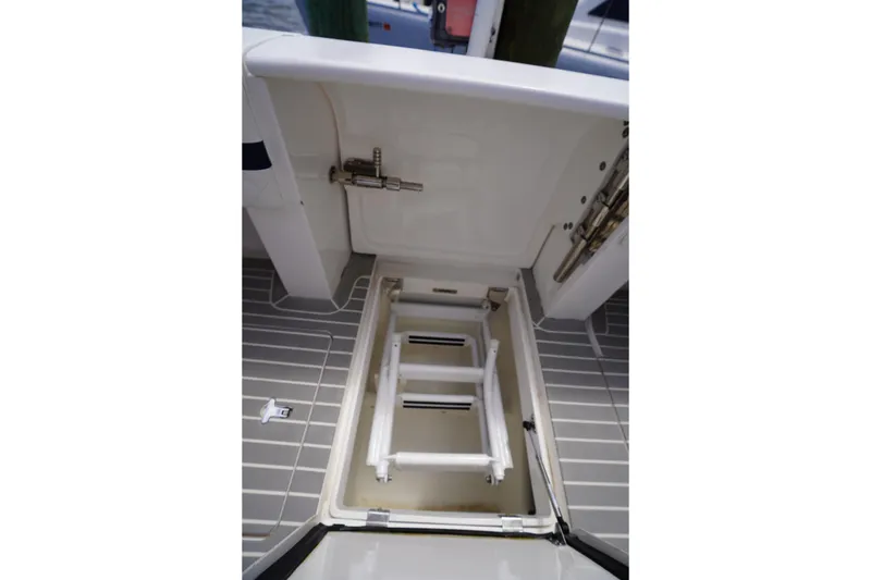 Slide: The Image of Open hatch with ladder on 2015 Intrepid 400 Cuddy boat deck. - 68