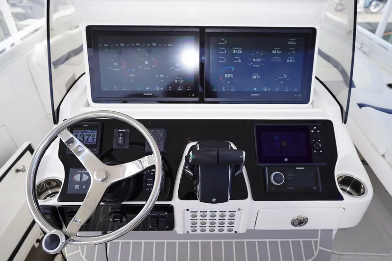 Slide: The Image of Helm of 2015 Intrepid 400 Cuddy with advanced navigation displays and controls. - 71