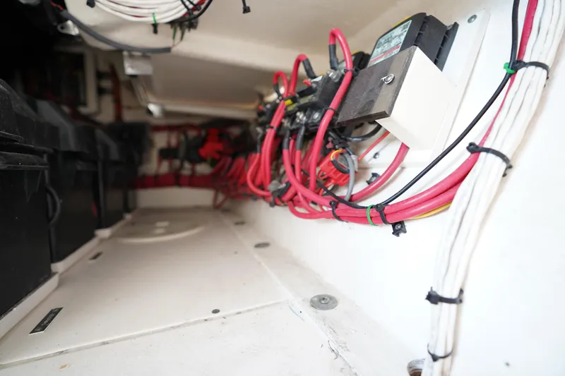 Slide: The Image of Electrical wiring and components inside a 2015 Intrepid 400 Cuddy boat. - 75