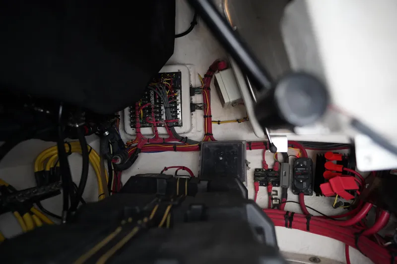 Slide: The Image of Electrical wiring and components inside a 2015 Intrepid 400 Cuddy boat. - 76