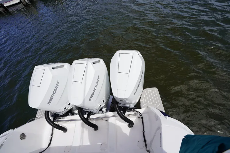 Slide: The Image of Triple Mercury outboard engines on a 2015 Intrepid 400 Cuddy boat. - 85
