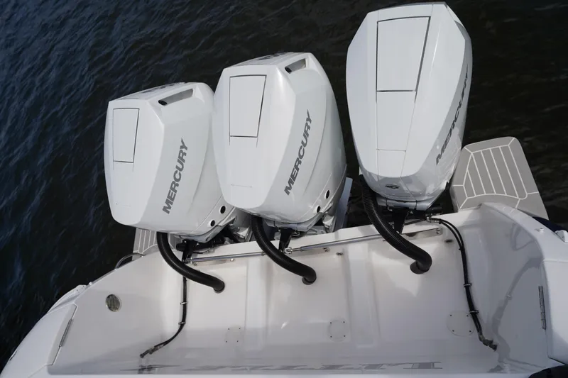 Slide: The Image of Triple Mercury outboard engines on a 2015 Intrepid 400 Cuddy boat. - 87
