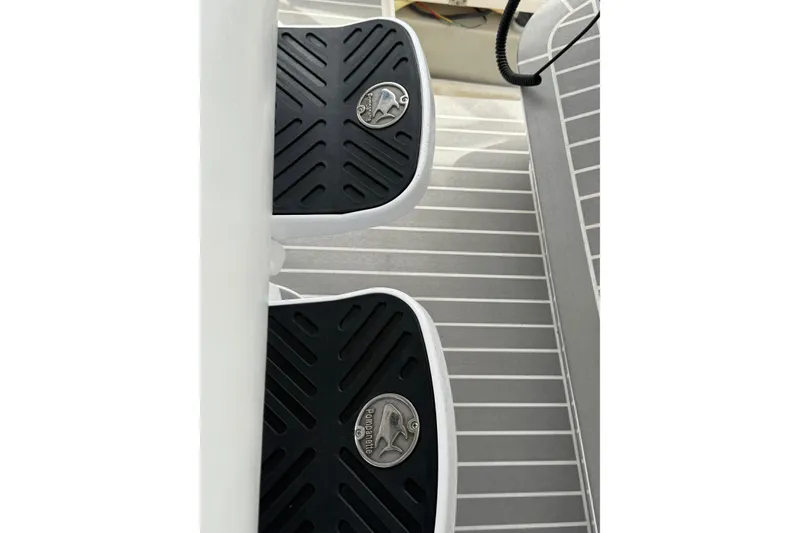 Slide: The Image of Deck detail of a 2015 Intrepid 400 Cuddy boat with black non-slip pads. - 9