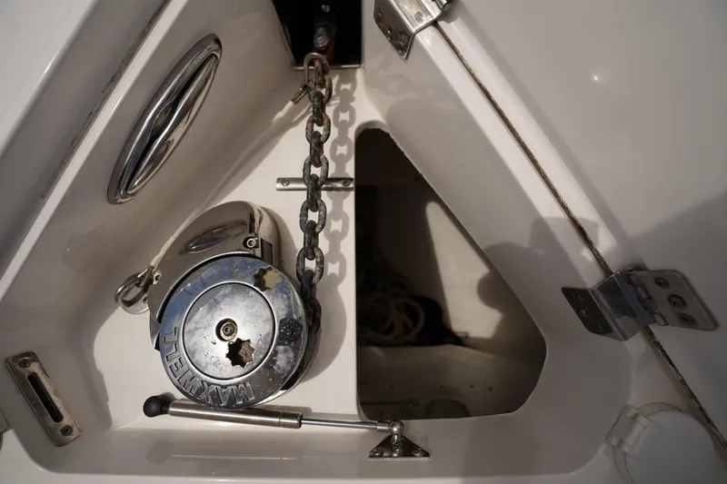 Slide: The Image of Anchor chain compartment of 2015 Intrepid 400 Cuddy boat, featuring Maxwell windlass system. - 90