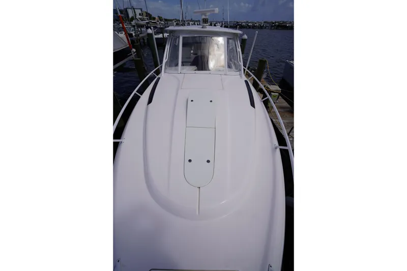 Slide: The Image of 2015 Intrepid 400 Cuddy boat docked at marina, viewed from above. - 91