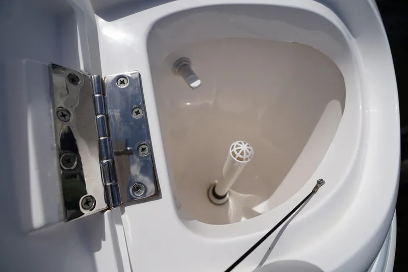 Slide: The Image of Hinged compartment on 2015 Intrepid 400 Cuddy boat, featuring stainless steel hardware. - 97