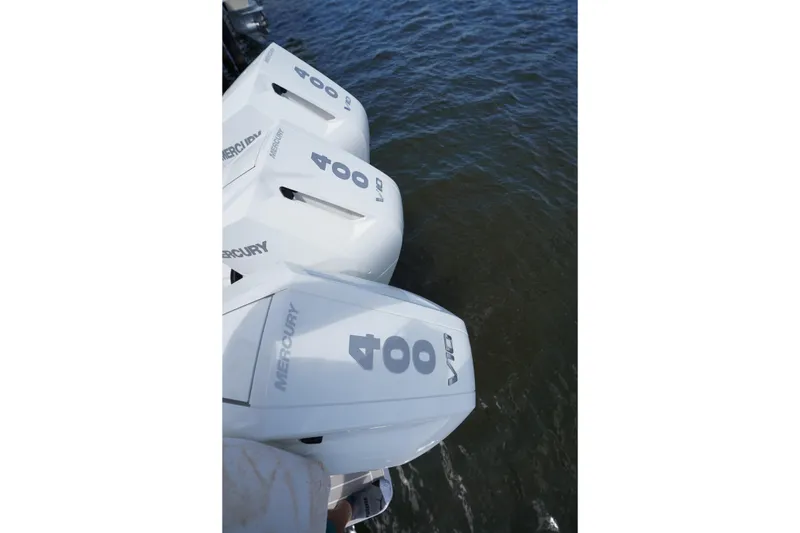 Slide: The Image of Triple Mercury 400 V10 outboard engines on a 2015 Intrepid 400 Cuddy boat. - 99