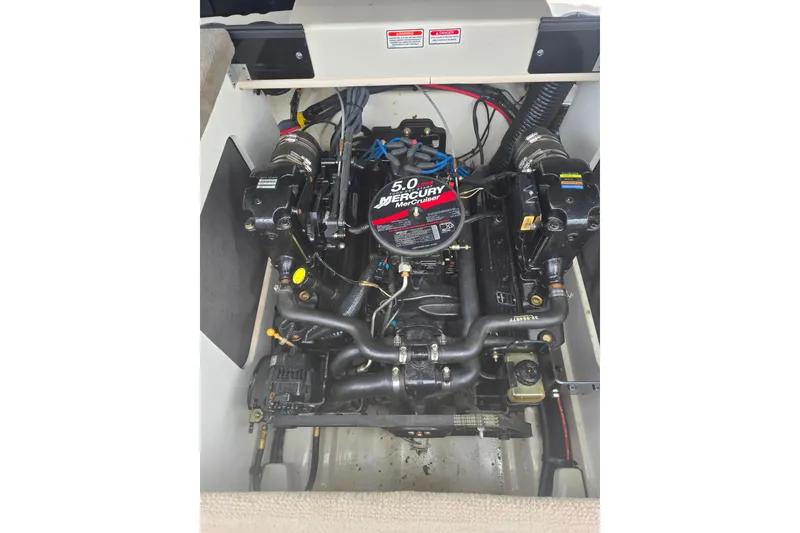 Slide: The Image of Engine compartment of a 2005 Sea Ray 200 Bow Rider with a 5.0 Mercury MerCruiser engine. - 10