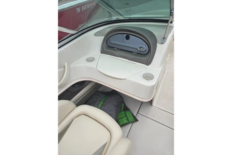 Slide: The Image of Interior of a 2005 Sea Ray 200 Bow Rider boat, featuring seating and storage. - 8