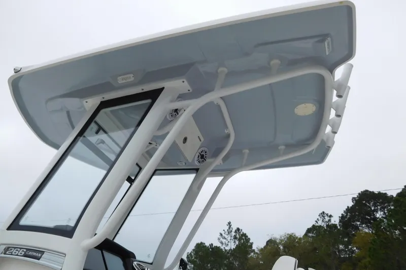 Slide: The Image of 2023 Robalo 266 Cayman boat's T-top and console, showcasing sleek design and functionality. - 3