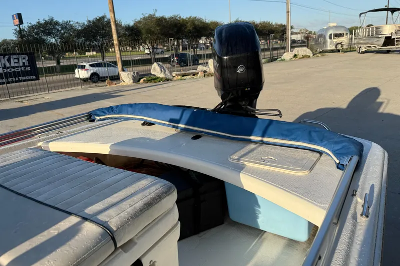 Slide: The Image of 2017 Mako Pro Skiff 17 CC boat with motor, parked outdoors. - 10