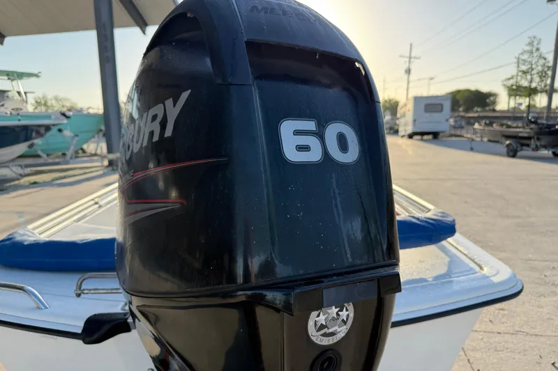 Slide: The Image of Mercury 60 horsepower outboard motor on a 2017 Mako Pro Skiff 17 CC boat. - 11