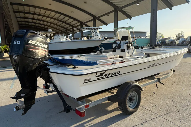 Slide: The Image of 2017 Mako Pro Skiff 17 CC boat with Mercury 60 engine on trailer. - 12
