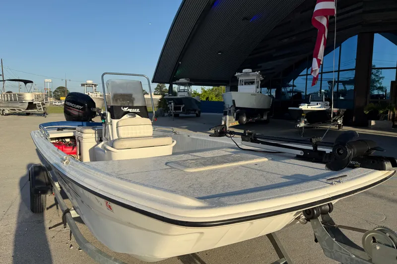 Slide: The Image of 2017 Mako Pro Skiff 17 CC boat on trailer, parked outside dealership. - 5