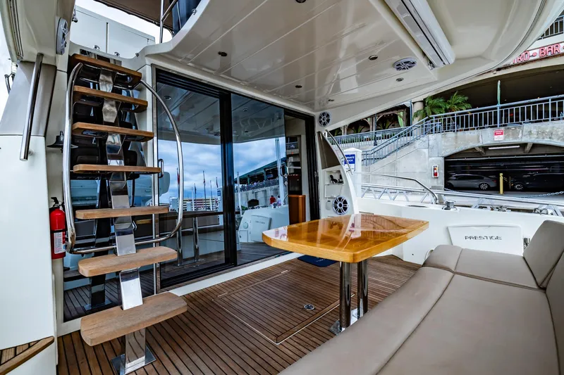 Slide: The Image of Prestige 500 Fly 2013 yacht interior with wooden stairs and seating area. - 10