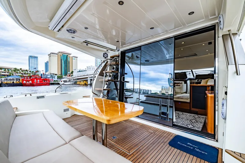 Slide: The Image of 2013 Prestige 500 Fly yacht with elegant interior and cityscape view. - 11