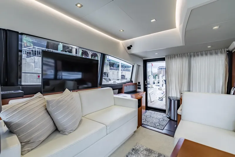 Slide: The Image of Luxurious interior of 2013 Prestige 500 Fly yacht with modern furnishings and large windows. - 15