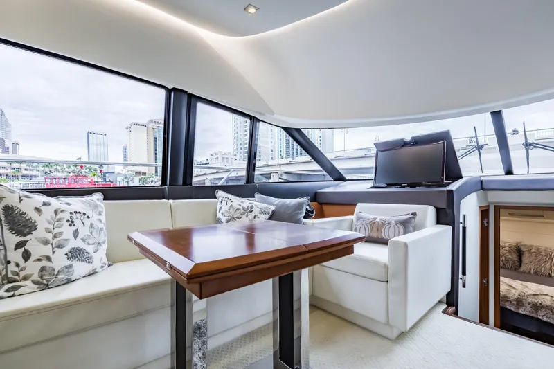 Slide: The Image of Luxurious interior of 2013 Prestige 500 Fly yacht with elegant seating and city view. - 16