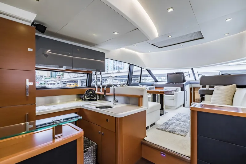 Slide: The Image of Luxurious interior of 2013 Prestige 500 Fly yacht with modern kitchen and seating area. - 18