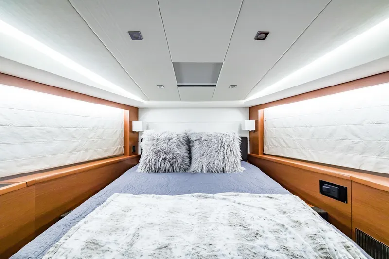 Slide: The Image of Luxurious bedroom interior of 2013 Prestige 500 Fly yacht with plush bedding and modern lighting. - 29