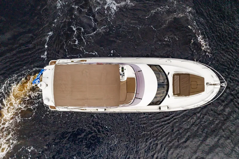 Slide: The Image of Aerial view of 2013 Prestige 500 Fly yacht cruising on dark water. - 8