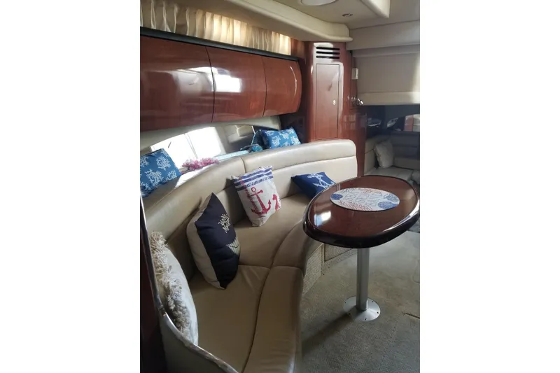 Slide: The Image of Luxurious interior of 2004 Sea Ray 360 Sundancer yacht with elegant seating and nautical decor. - 11