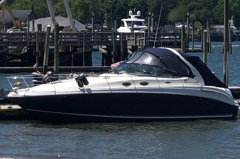 The Image of 2004 Sea Ray 360 Sundancer yacht docked at a marina. - 3