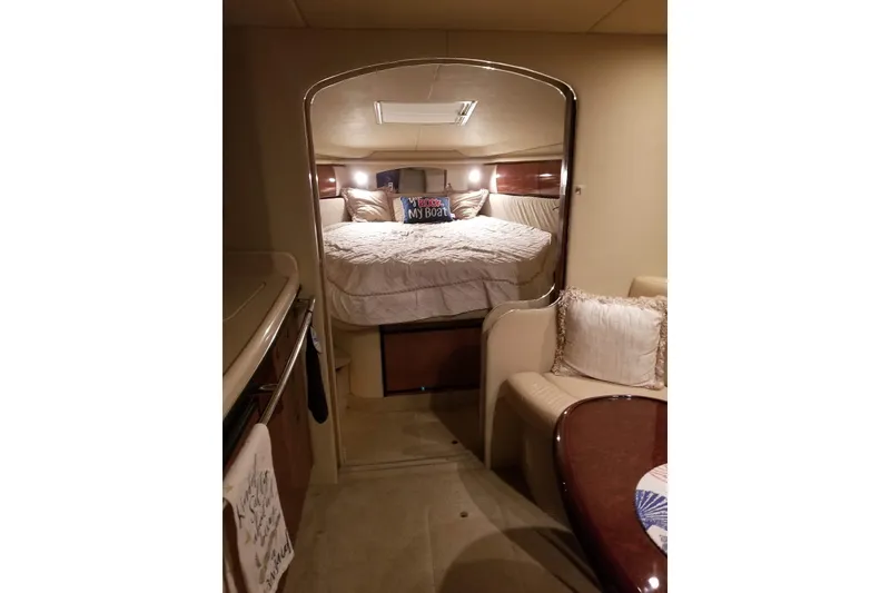 Slide: The Image of Interior of 2004 Sea Ray 360 Sundancer yacht with cozy bedroom and seating area. - 8