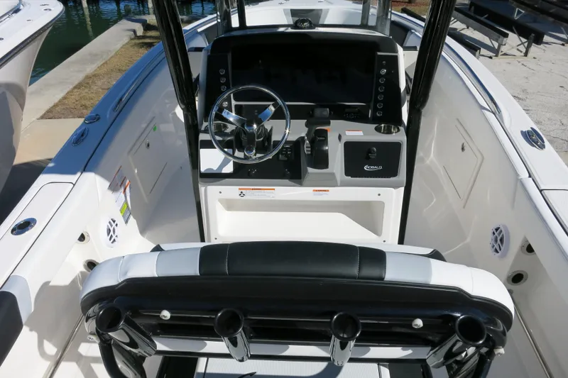 Slide: The Image of 2026 Robalo R230 Center Console boat interior with steering wheel and control panel. - 10