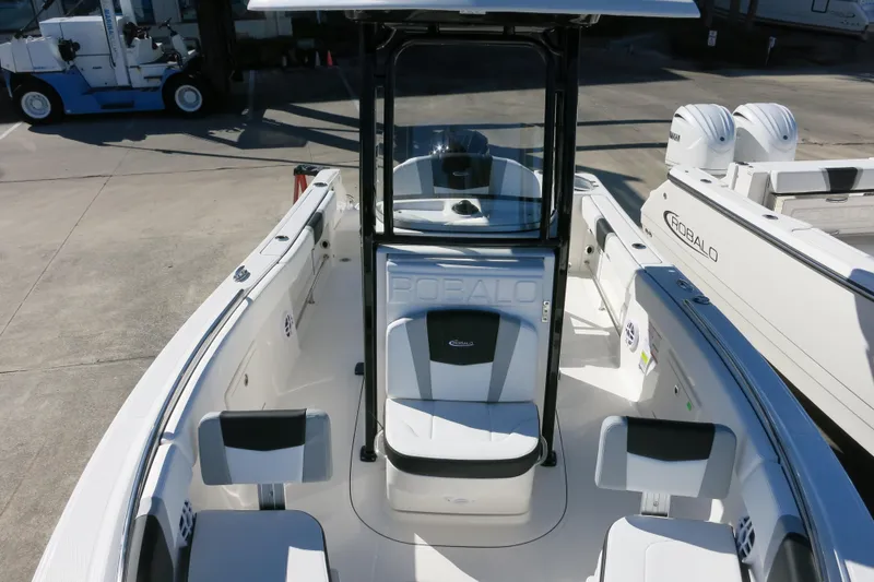 Slide: The Image of 2026 Robalo R230 Center Console boat interior with seating and console view. - 20