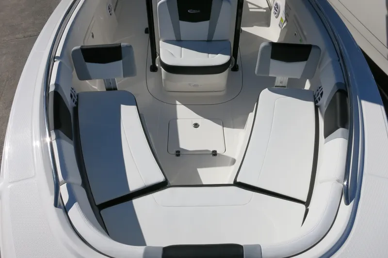 Slide: The Image of 2026 Robalo R230 Center Console boat interior with white seating and modern design. - 21
