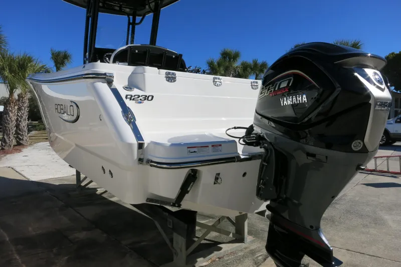 Slide: The Image of 2026 Robalo R230 Center Console boat with Yamaha engine, displayed outdoors. - 6