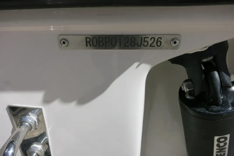 Slide: The Image of 2026 Robalo R230 Center Console boat identification plate and hardware detail. - 8
