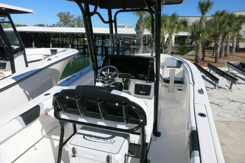 Slide: The Image of 2026 Robalo R230 Center Console boat with sleek design and modern dashboard. - 9