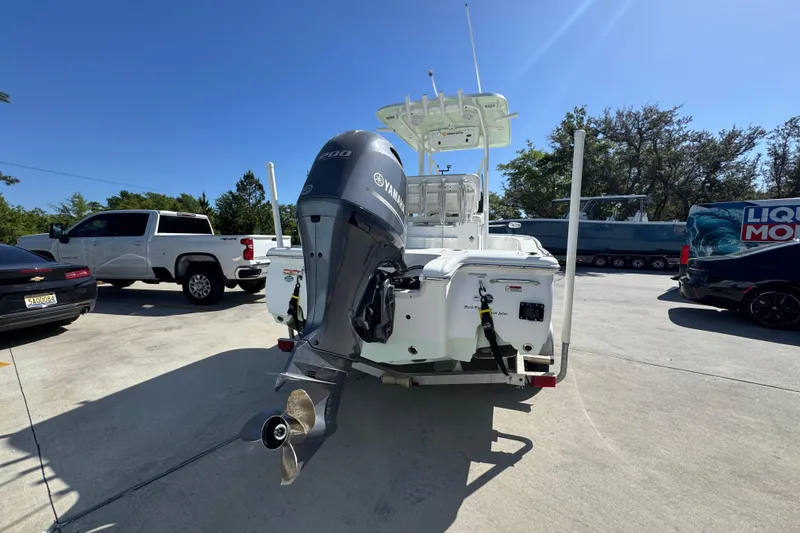Slide: The Image of 2019 Sea Hunt BX 22 BR boat with Yamaha engine, parked outdoors on a sunny day. - 11