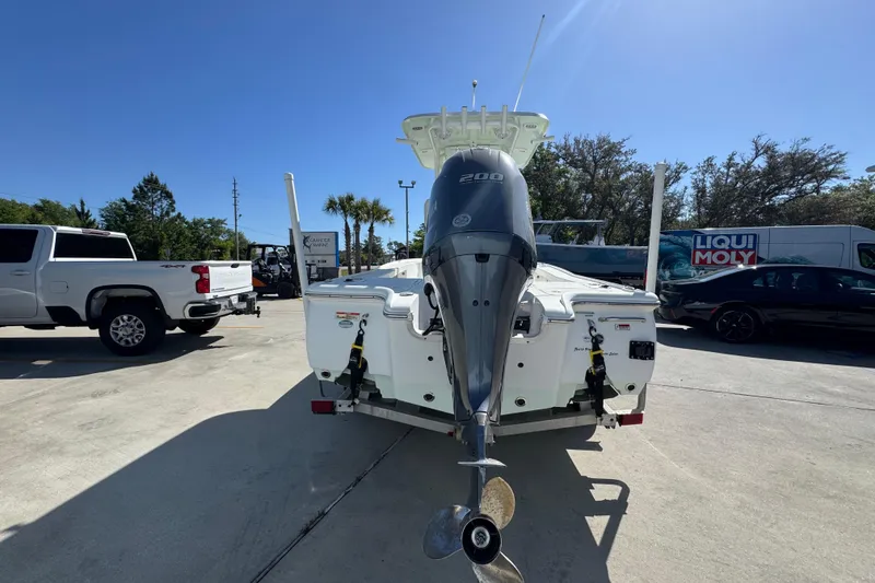 Slide: The Image of 2019 Sea Hunt BX 22 BR boat with 200 HP engine in a parking lot. - 12