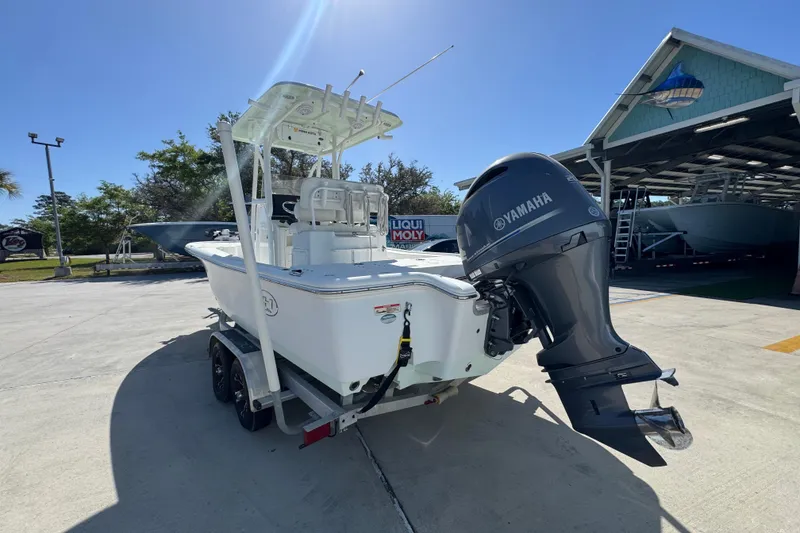 Slide: The Image of 2019 Sea Hunt BX 22 BR boat with Yamaha outboard motor on trailer. - 13