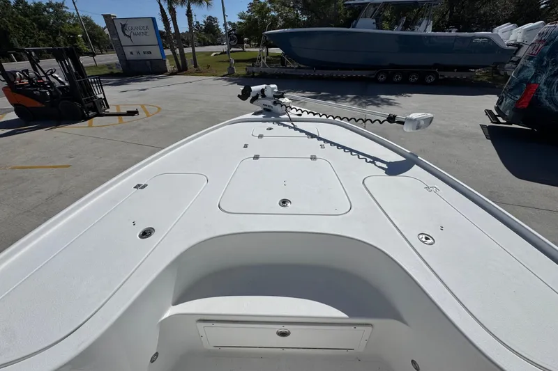 Slide: The Image of 2019 Sea Hunt BX 22 BR boat deck with trolling motor, parked outdoors. - 16