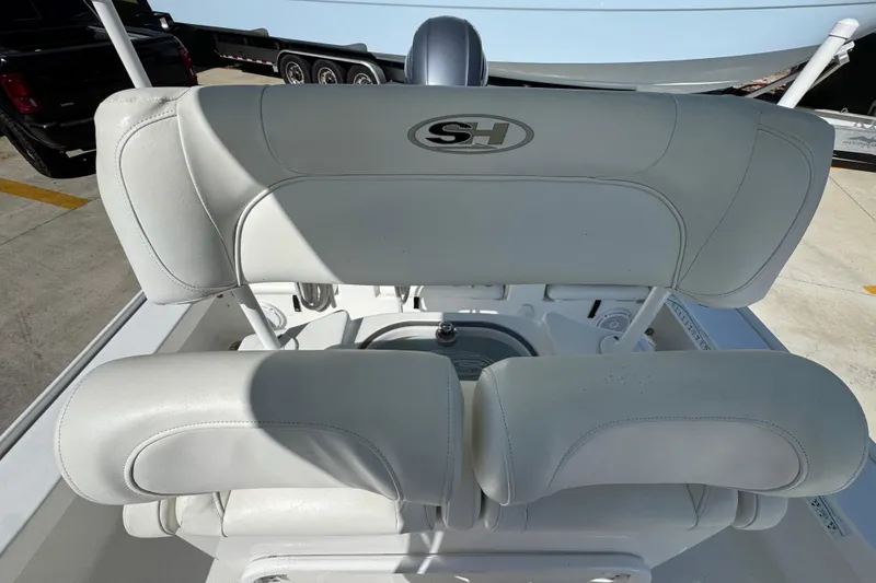 Slide: The Image of 2019 Sea Hunt BX 22 BR boat with white cushioned seating and SH logo. - 25