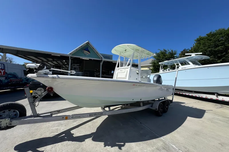 Slide: The Image of 2019 Sea Hunt BX 22 BR boat on trailer under clear blue sky. - 3
