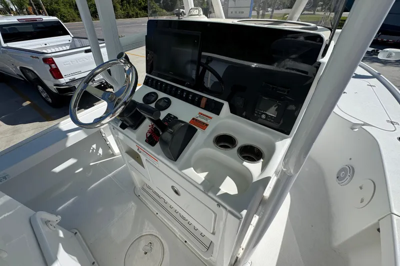 Slide: The Image of 2019 Sea Hunt BX 22 BR boat console with steering wheel and controls. - 30