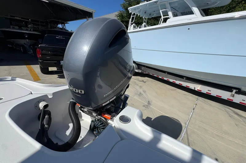 Slide: The Image of 2019 Sea Hunt BX 22 BR boat with Yamaha 200 outboard motor in a marina setting. - 39