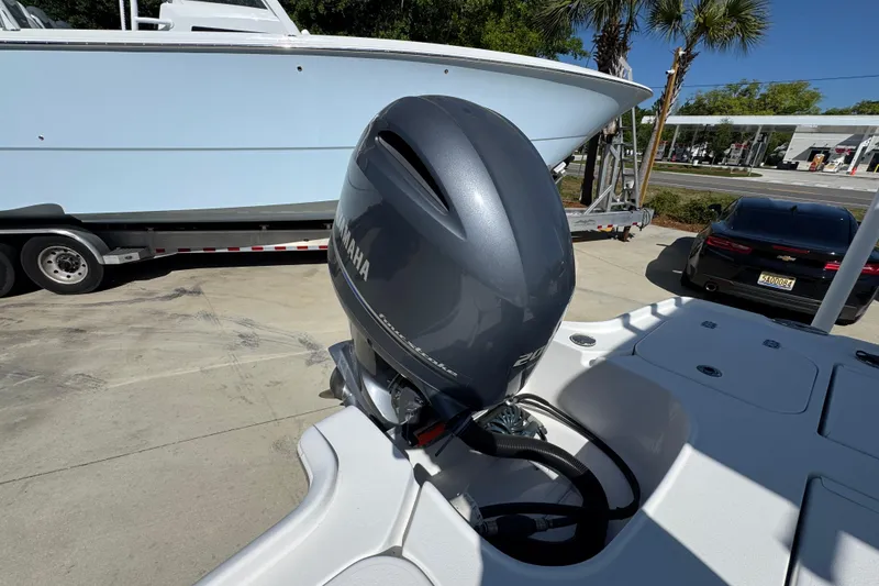 Slide: The Image of 2019 Sea Hunt BX 22 BR boat with Yamaha outboard motor in a parking area. - 40