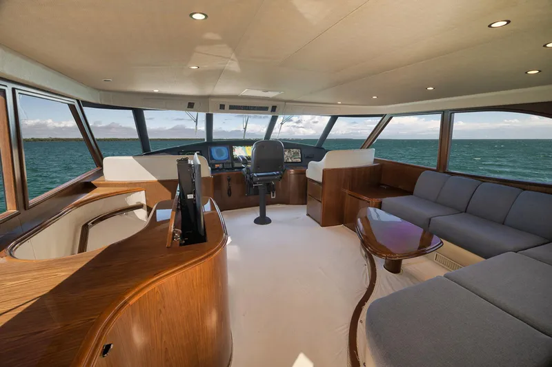 Slide: The Image of Luxurious interior of 2015 Viking 76 Enclosed Bridge yacht with panoramic ocean views. - 22